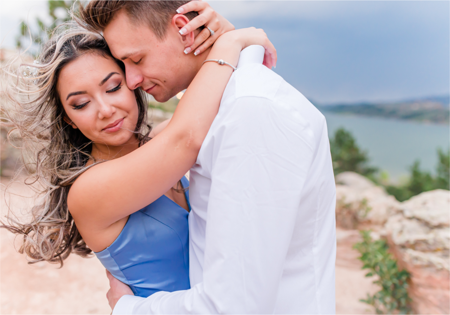 Romantic and Playful Summer engagement session at Horsetooth Reservoir in Fort Collins Colorado | Britni Girard Photographer | Wedding photographer and videographer team | Stormy and Windy Engagement on the cliffs of Horsetooth | Rotary Park