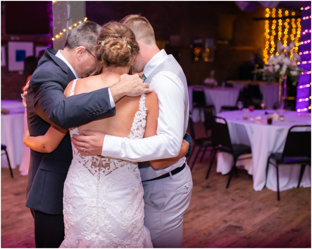 Candlelit Reception at The Warehouse in Colorado Springs | Britni Girard Photography | Colorado Wedding Photo and Video Team | Flowers by A Wildflower Florist | DJ Jay Kacik | Prayer over the couple before they leave