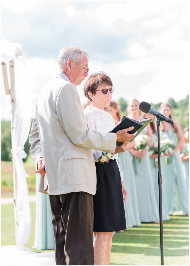 Elegant wedding on the chipping green at Cheyenne Mountain Resort | Britni Girard Photography | Colorado Wedding Photo and Video Team | Grandparents singing How Great Thou Art