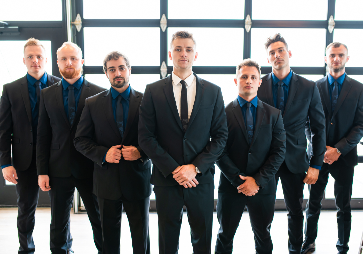 Romantic and Rustic Wedding at The Mill in Windsor | Britni Girard Photography | Colorado based wedding photography and videography team | Groomsmen the the bar at The Windsor Mill | Royal Blue and White Wedding | Groomsmen attire from Express