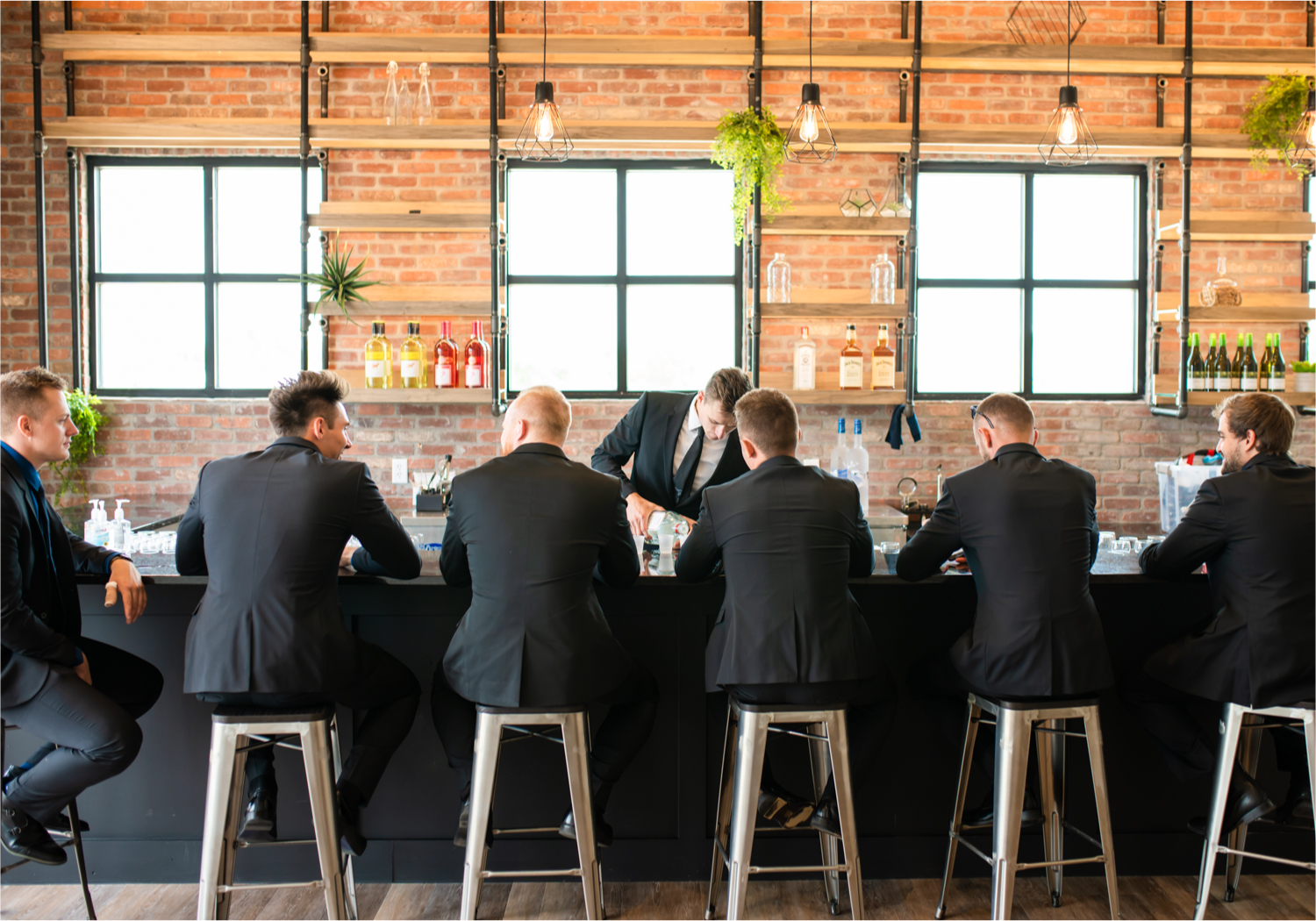 Romantic and Rustic Wedding at The Mill in Windsor | Britni Girard Photography | Colorado based wedding photography and videography team | Groomsmen the the bar at The Windsor Mill | Royal Blue and White Wedding | Groomsmen attire from Express
