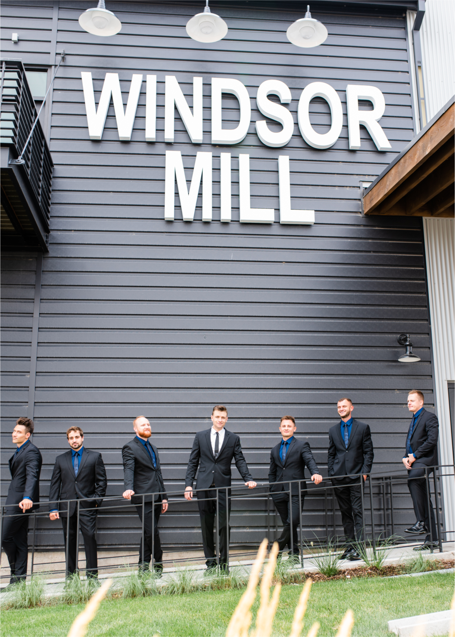 Romantic and Rustic Wedding at The Mill in Windsor | Britni Girard Photography | Colorado based wedding photography and videography team | Groomsmen outside The Windsor Mill | Royal Blue and White Wedding | Groomsmen attire from Express
