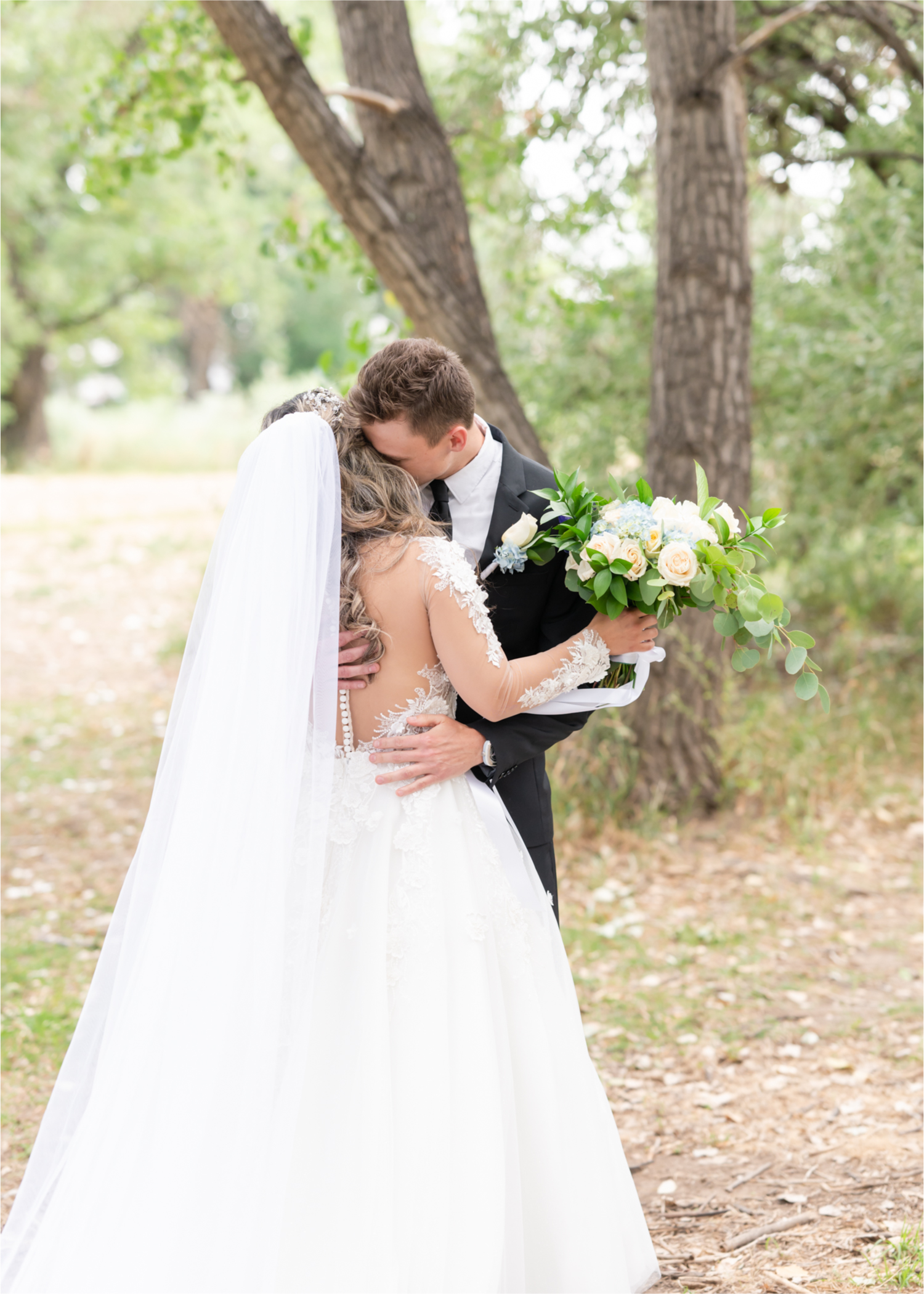 Romantic and Rustic Wedding at The Mill in Windsor | Britni Girard Photography | Colorado based wedding photography and videography team | Bride and Groom Portraits First Look at Eastman park