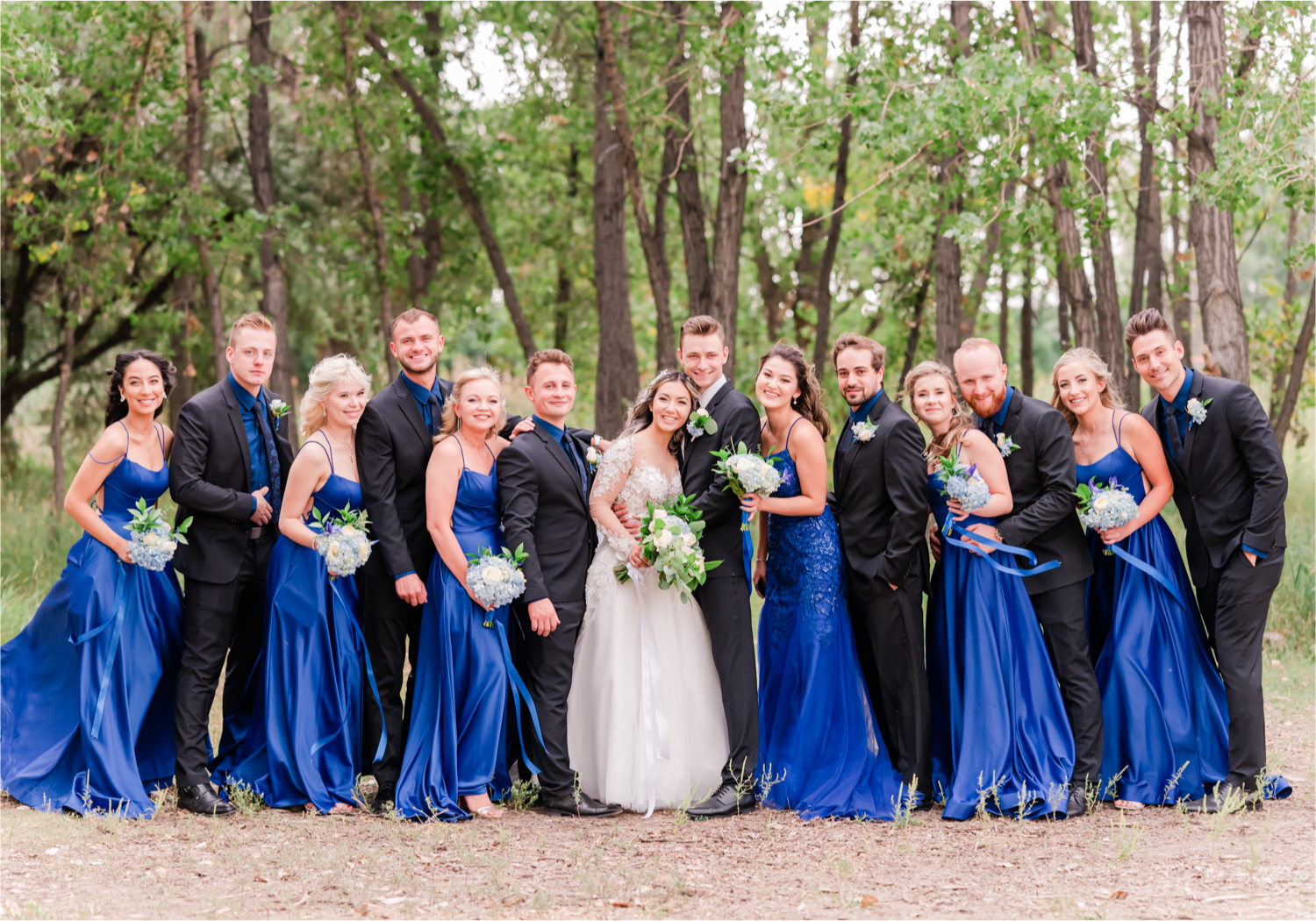 Romantic and Rustic Wedding at The Mill in Windsor | Britni Girard Photography | Colorado based wedding photography and videography team | Royal Blue and White Bridal Party