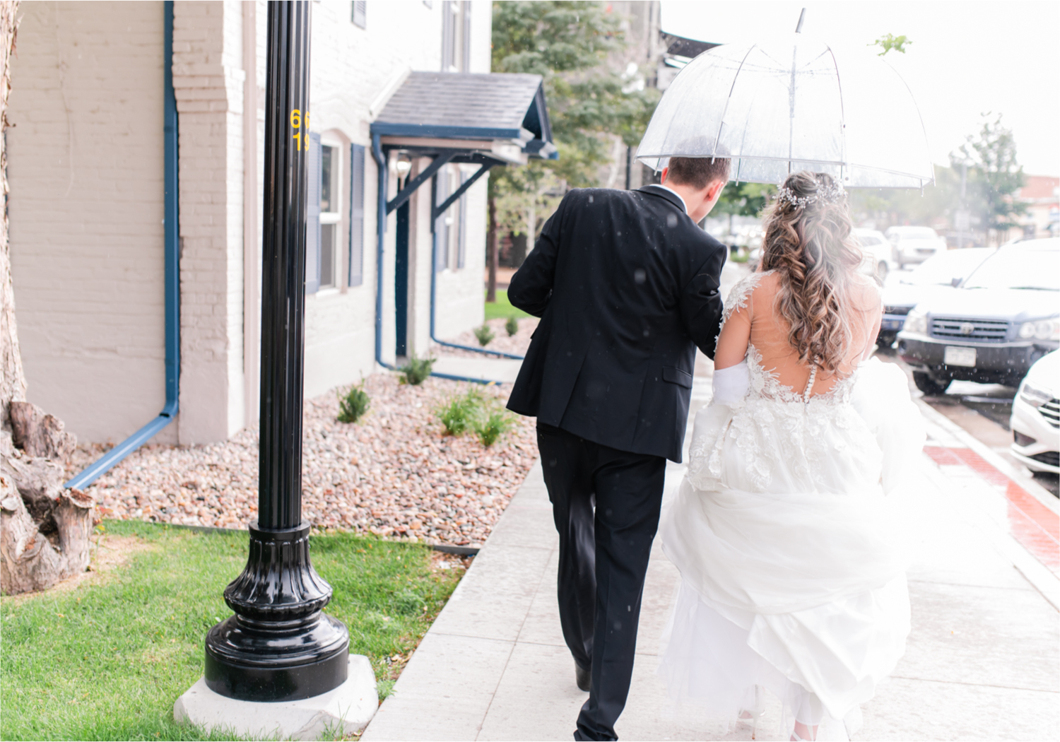 Romantic and Rustic Wedding at The Mill in Windsor | Britni Girard Photography | Colorado based wedding photography and videography team | Bride and groom in rain