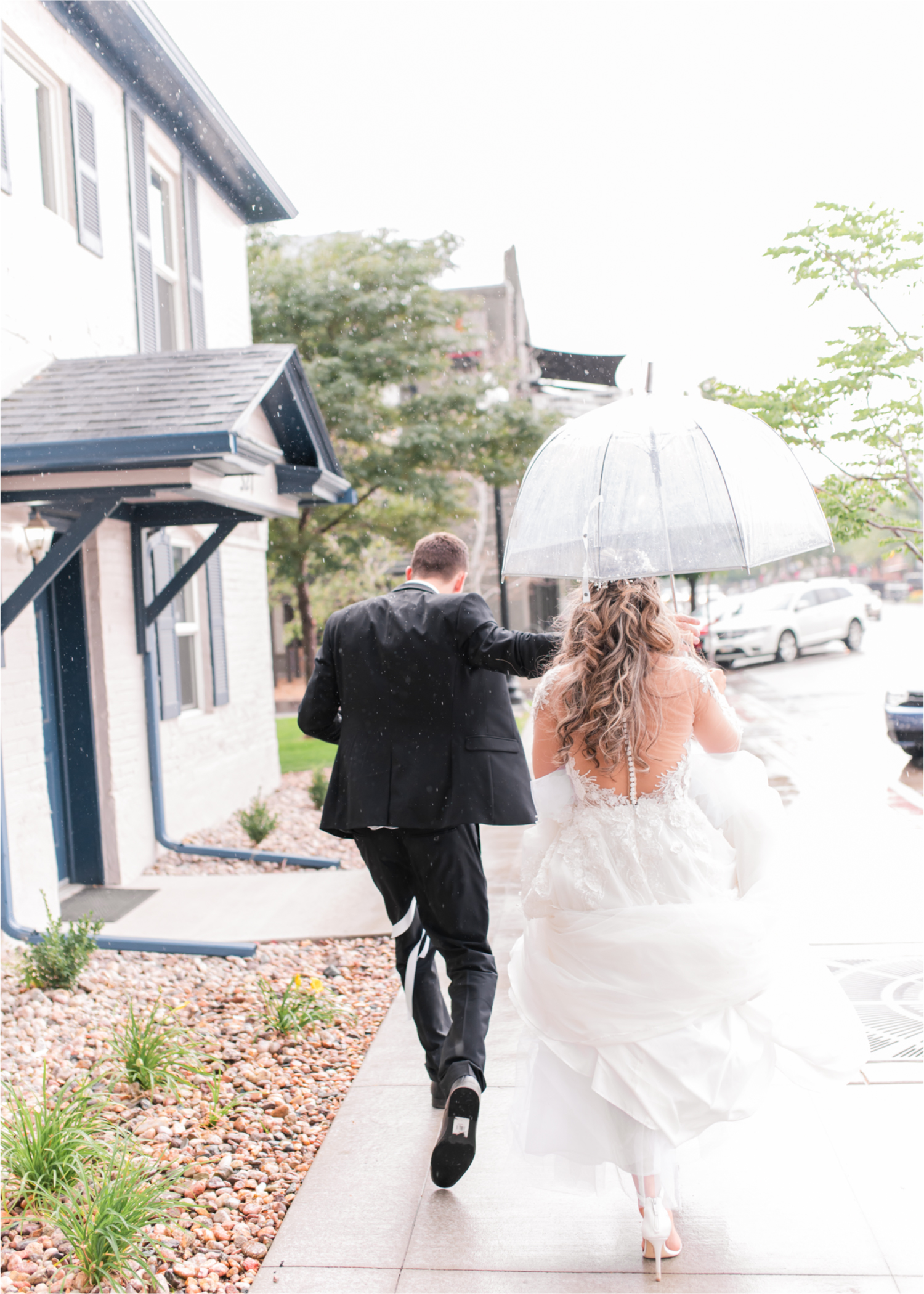 Romantic and Rustic Wedding at The Mill in Windsor | Britni Girard Photography | Colorado based wedding photography and videography team | Bride and groom in rain