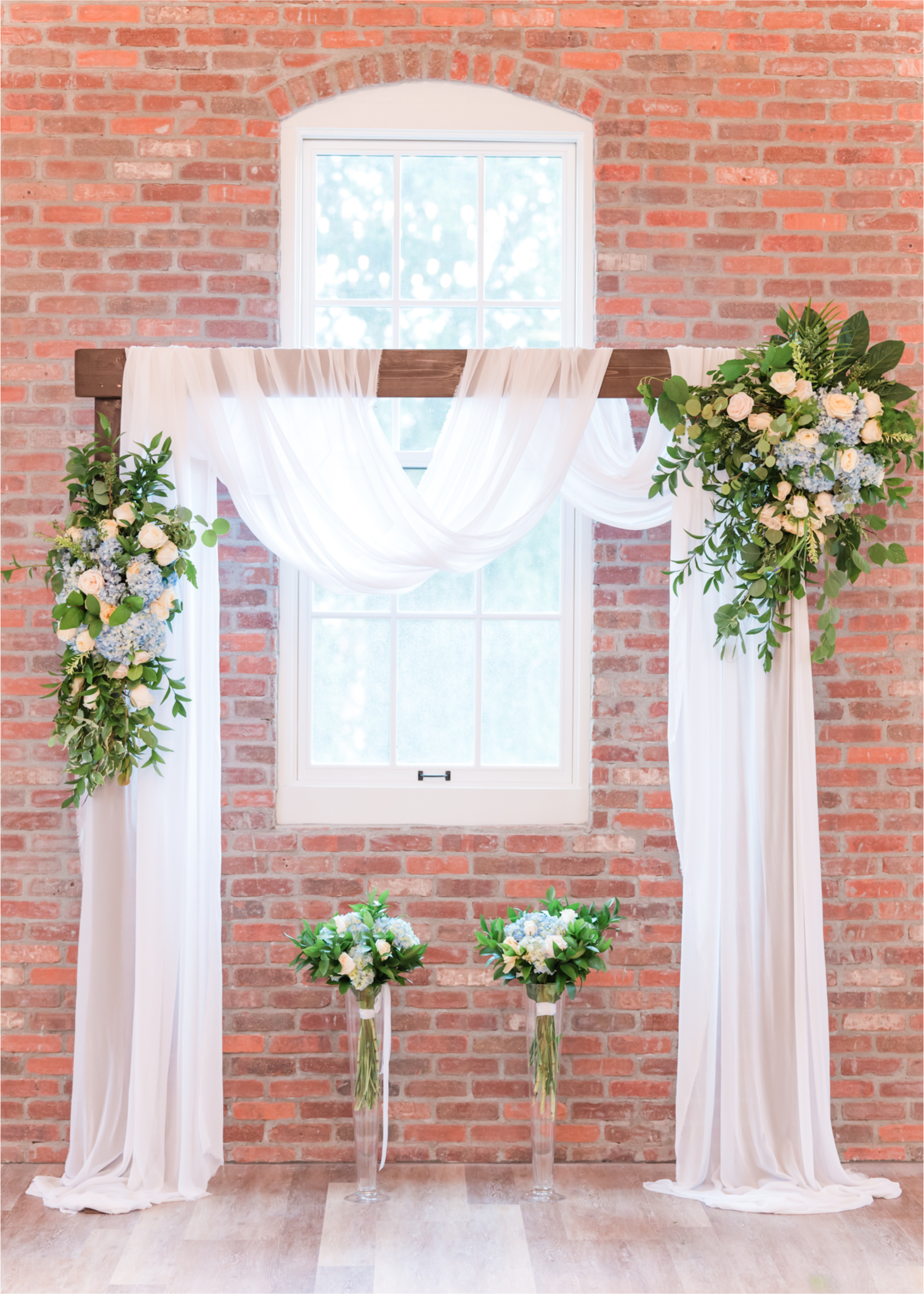 Romantic and Rustic Wedding at The Mill in Windsor | Britni Girard Photography | Colorado based wedding photography and videography team | Royal Blue and white Wedding - Floral Arch