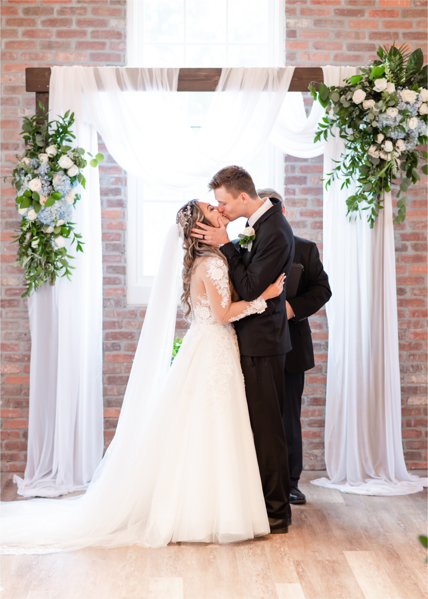 Romantic and Rustic Wedding at The Mill in Windsor | Britni Girard Photography | Colorado based wedding photography and videography team | Bride and groom first kiss
