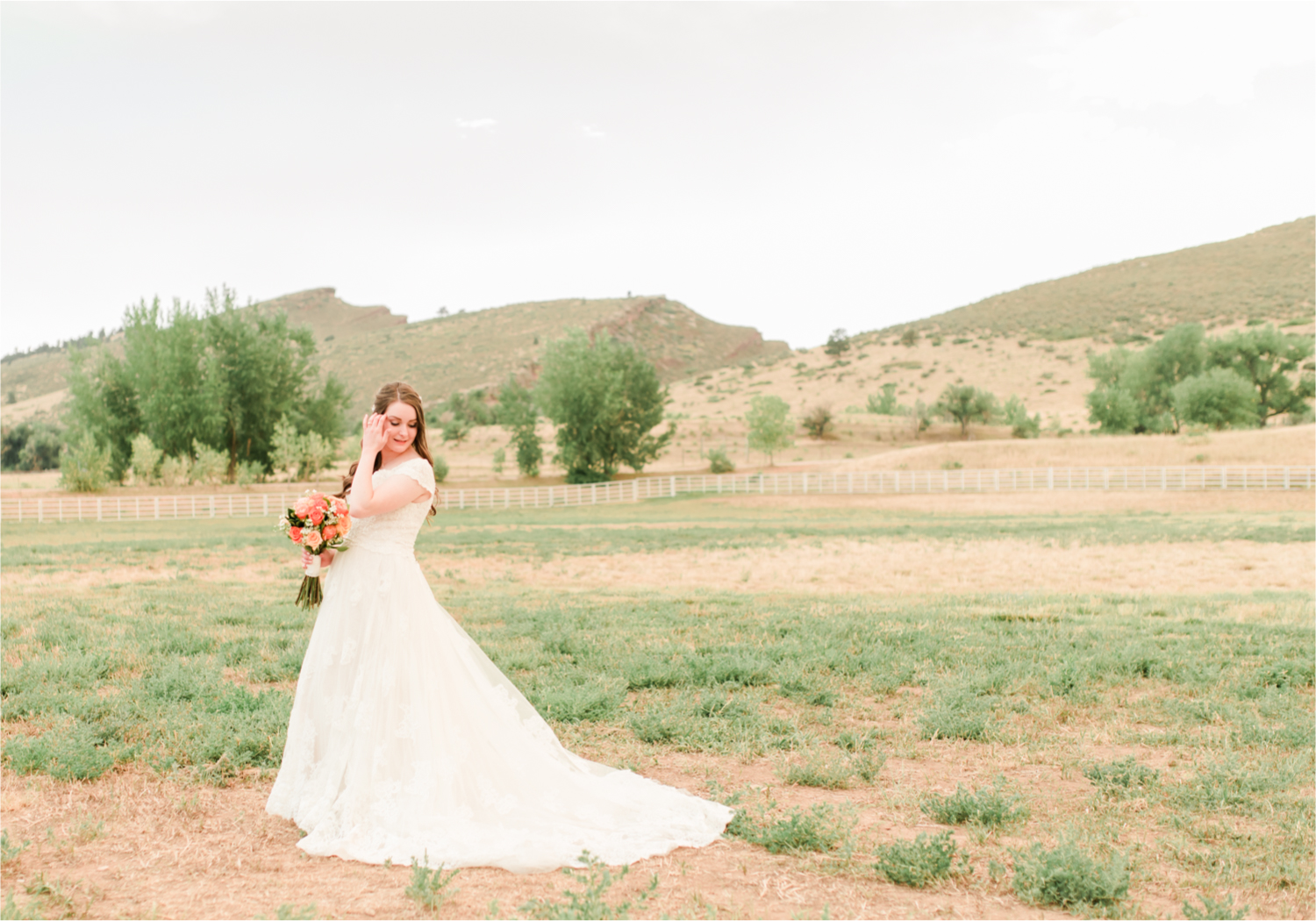 Summer Ellis Ranch Wedding in Loveland Colorado | Britni Girard Photography | Wedding Photo and Video Team | Bride hair Dondi AtWow from Sola Salon in Loveland | Floral hair crystals | Bridal Portraits | Orange Bouquet | Country Field Bride