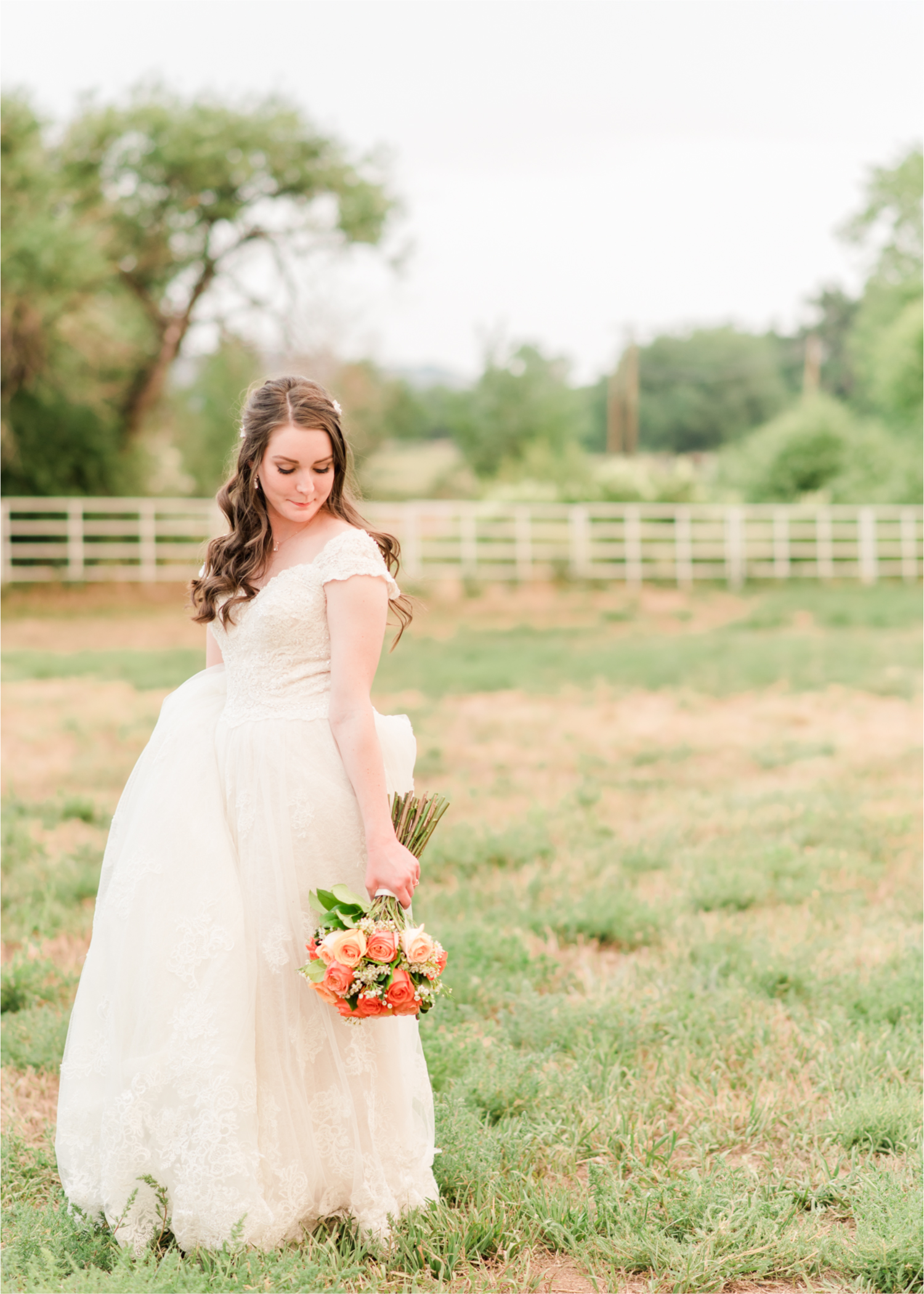 Summer Ellis Ranch Wedding in Loveland Colorado | Britni Girard Photography | Wedding Photo and Video Team | Bride hair Dondi AtWow from Sola Salon in Loveland | Floral hair crystals | Bridal Portraits | Orange Bouquet | Country Field Bride