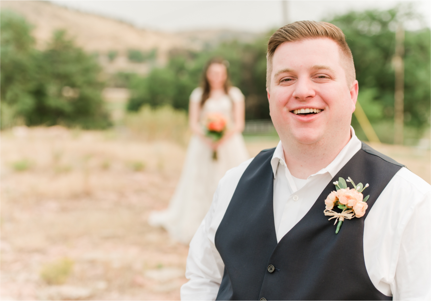 Summer Ellis Ranch Wedding in Loveland Colorado | Britni Girard Photography | Wedding Photo and Video Team | Dark Blue and Orange Bridal Bouquet | First Look on top of colorado mountain | Red Rocks