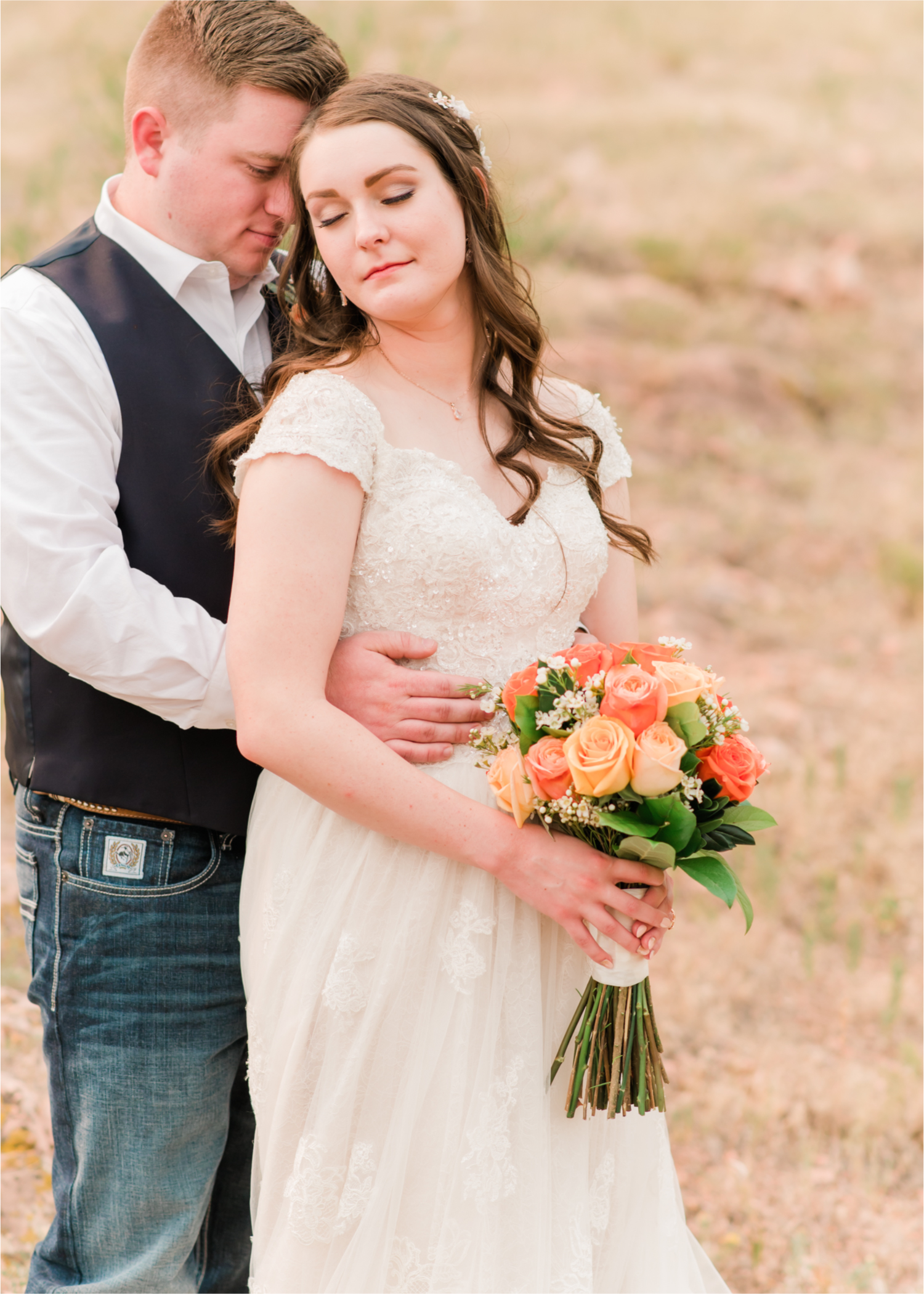 Summer Ellis Ranch Wedding in Loveland Colorado | Britni Girard Photography | Wedding Photo and Video Team | Dark Blue and Orange Bridal Bouquet