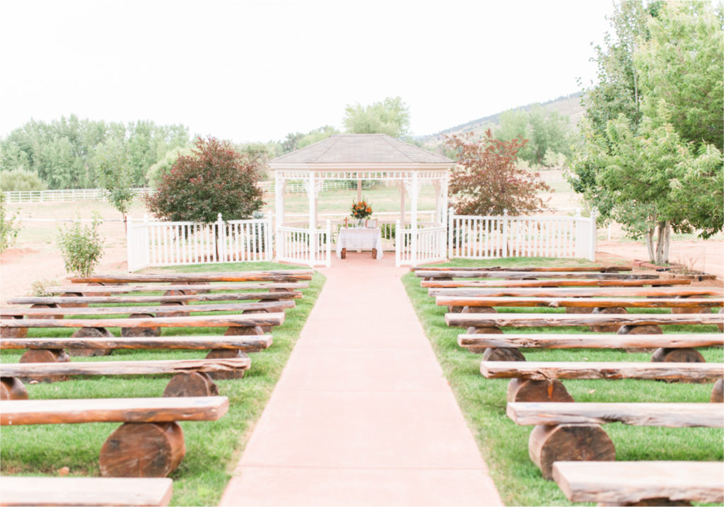 Summer Ellis Ranch Wedding in Loveland Colorado | Britni Girard Photography | Wedding Photo and Video Team | Gazebo Ceremony on Rustic Colorado Ranch with wood benches