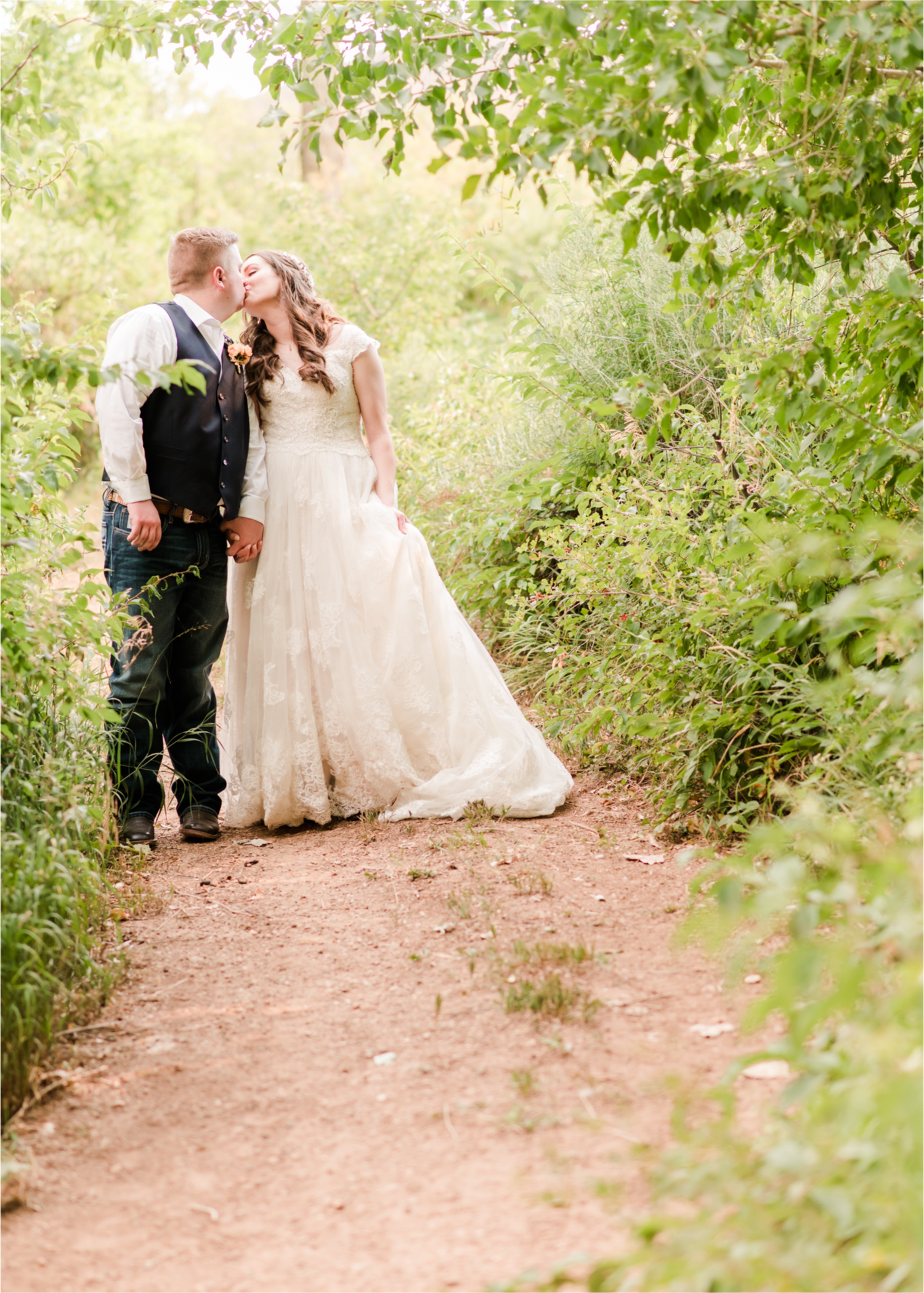 Summer Ellis Ranch Wedding in Loveland Colorado | Britni Girard Photography | Wedding Photo and Video Team | Bride and Groom Romantic trail walk