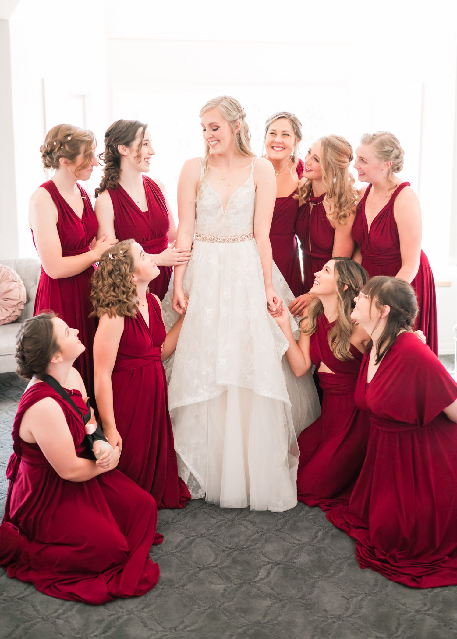 Romantic Whimsical Wedding at the Lionscrest Manor in Lyons, CO | Britni Girard Photography - Wedding Photo and Video Team | Rustic Fall Decor mixed in Burgundy, Blush, Gold and Sage | Wedding Dress from Anna Be Bridal by Hailey Paige | Hair and Makeup by Glam 5280 Chaundra Revier | Bridesmaids getting ready in Burgundy wrap dresses