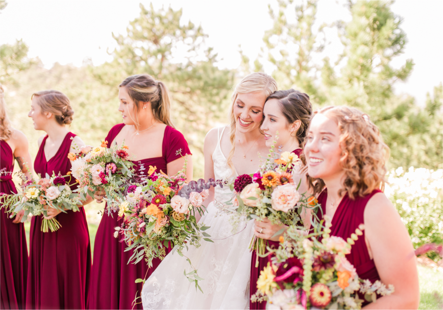 Romantic Whimsical Wedding at the Lionscrest Manor in Lyons, CO | Britni Girard Photography - Wedding Photo and Video Team | Rustic Fall Decor mixed in Burgundy, Blush, Gold and Sage | Wedding Dress from Anna Be Bridal by Hailey Paige | Hair and Makeup by Glam 5280 Chaundra Revier | Bride and Bridesmaids | Florals by Aflorae