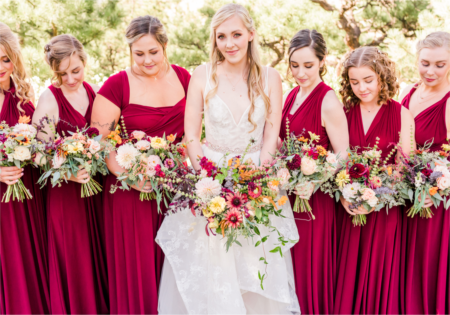 Romantic Whimsical Wedding at the Lionscrest Manor in Lyons, CO | Britni Girard Photography - Wedding Photo and Video Team | Rustic Fall Decor mixed in Burgundy, Blush, Gold and Sage | Wedding Dress from Anna Be Bridal by Hailey Paige | Hair and Makeup by Glam 5280 Chaundra Revier | Bride and Bridesmaids | Florals by Aflorae