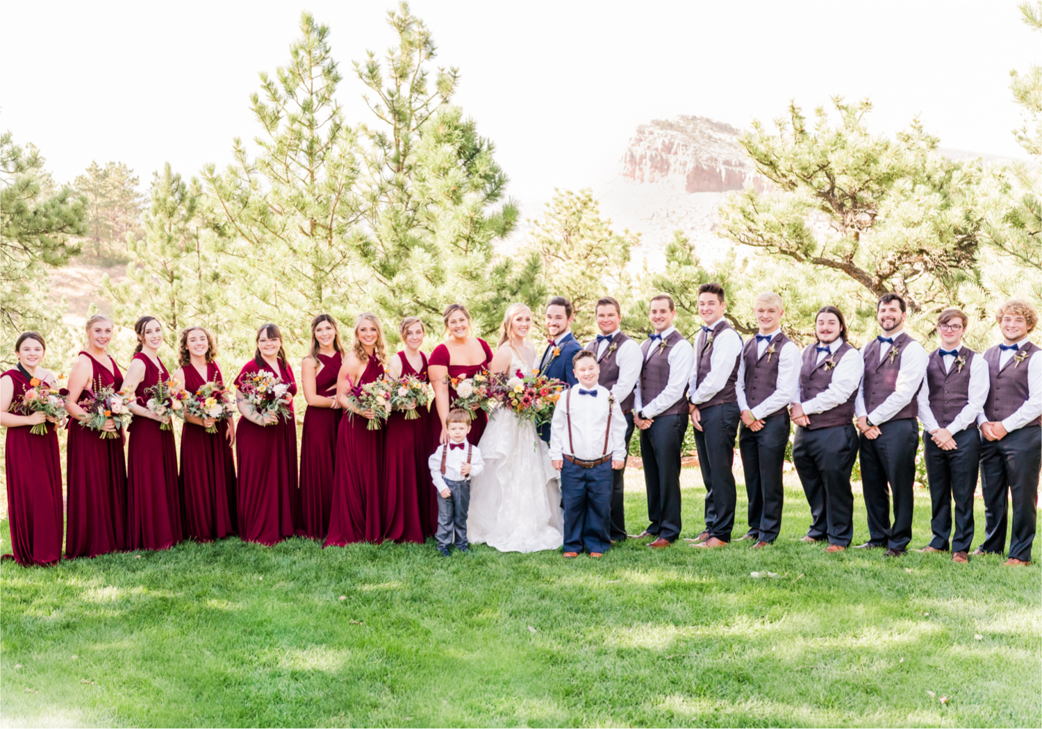 Romantic Whimsical Wedding at the Lionscrest Manor in Lyons, CO | Britni Girard Photography - Wedding Photo and Video Team | Rustic Fall Decor mixed in Burgundy, Blush, Gold and Sage | Large Bridal Party | Groom Custom Suit from Jos. a Banks | Bride Wedding Dress Anna Be Bridal, Hailey Paige | Florals By Aflorae | 