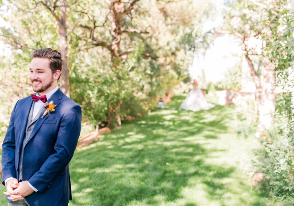 Romantic Whimsical Wedding at the Lionscrest Manor in Lyons, CO | Britni Girard Photography - Wedding Photo and Video Team | Rustic Fall Decor mixed in Burgundy, Blush, Gold and Sage | Groom in Custom Suit from Jos. a Banks | First Look Fakeout with groomsman