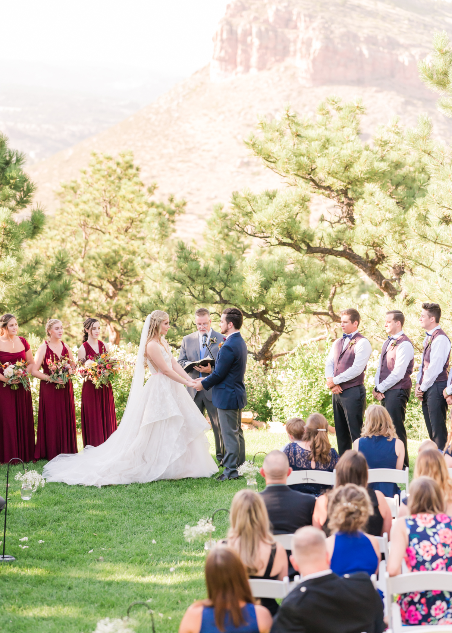 Romantic Whimsical Wedding at the Lionscrest Manor in Lyons, CO | Britni Girard Photography - Wedding Photo and Video Team | Rustic Fall Decor mixed in Burgundy, Blush, Gold and Sage | Wedding Dress from Anna Be Bridal by Hailey Paige | Hair and Makeup by Glam 5280 Chaundra Revier | Florals by Aflorae | Ceremony Site overlooking the Rocky Mountains | Mountaintop Ceremony before Sunset