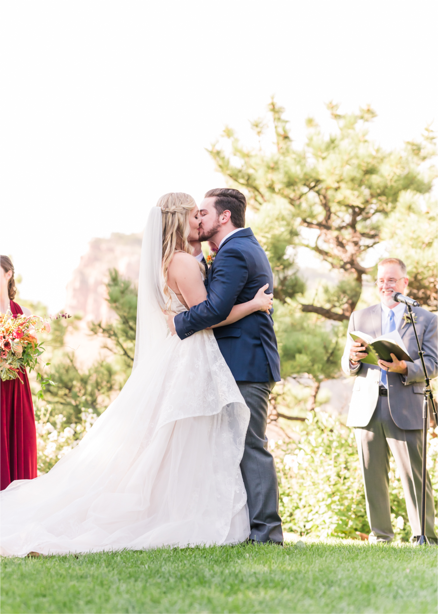 Romantic Whimsical Wedding at the Lionscrest Manor in Lyons, CO | Britni Girard Photography - Wedding Photo and Video Team | Rustic Fall Decor mixed in Burgundy, Blush, Gold and Sage | Wedding Dress from Anna Be Bridal by Hailey Paige | Hair and Makeup by Glam 5280 Chaundra Revier | Florals by Aflorae | Ceremony Site overlooking the Rocky Mountains | Mountaintop Ceremony before Sunset First Kiss