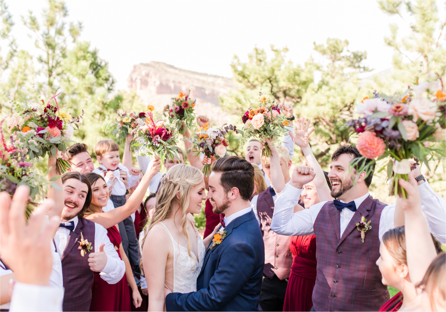 Romantic Whimsical Wedding at the Lionscrest Manor in Lyons, CO | Britni Girard Photography - Wedding Photo and Video Team | Rustic Fall Decor mixed in Burgundy, Blush, Gold and Sage | Large Bridal Party | Groom Custom Suit from Jos. a Banks | Bride Wedding Dress Anna Be Bridal, Hailey Paige | Florals By Aflorae | 