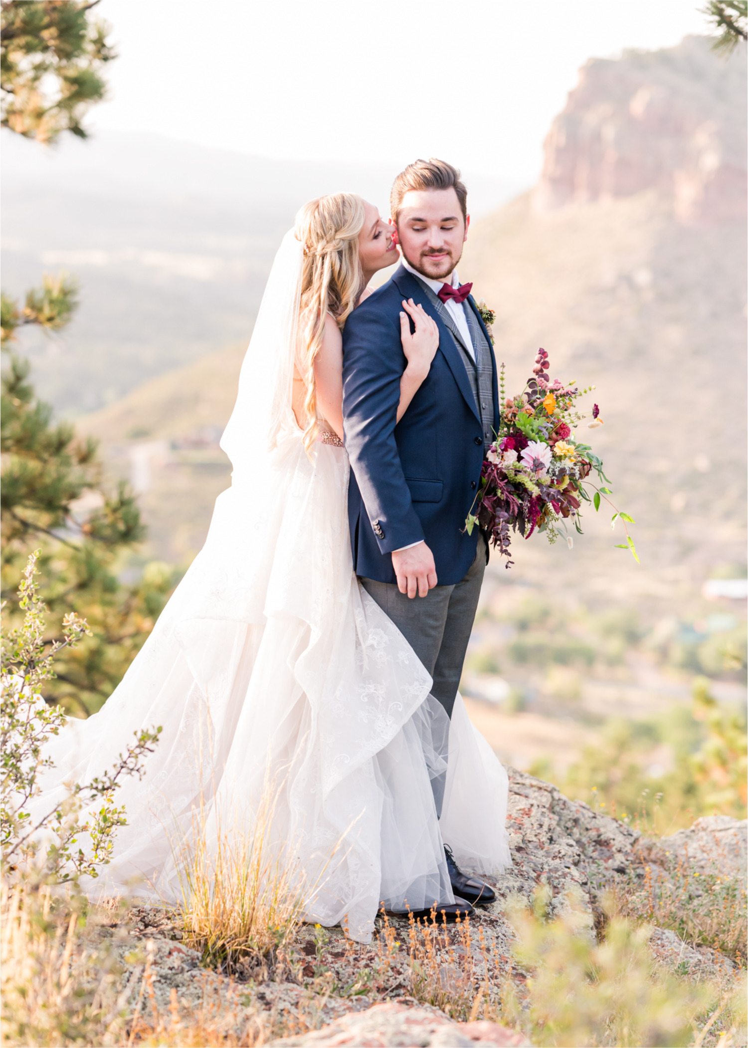 Romantic Whimsical Wedding at the Lionscrest Manor in Lyons, CO | Britni Girard Photography - Wedding Photo and Video Team | Rustic Fall Decor mixed in Burgundy, Blush, Gold and Sage | Groom in Custom Suit from Jos. a Banks | Romantic Bride and Groom Portraits in the rocky mountains | Wedding Dress from Anna Be Bridal by Hailey Paige | Hair and Makeup by Glam 5280 Chaundra Revier | Florals by Aflorae | Fine Art Wedding Photography