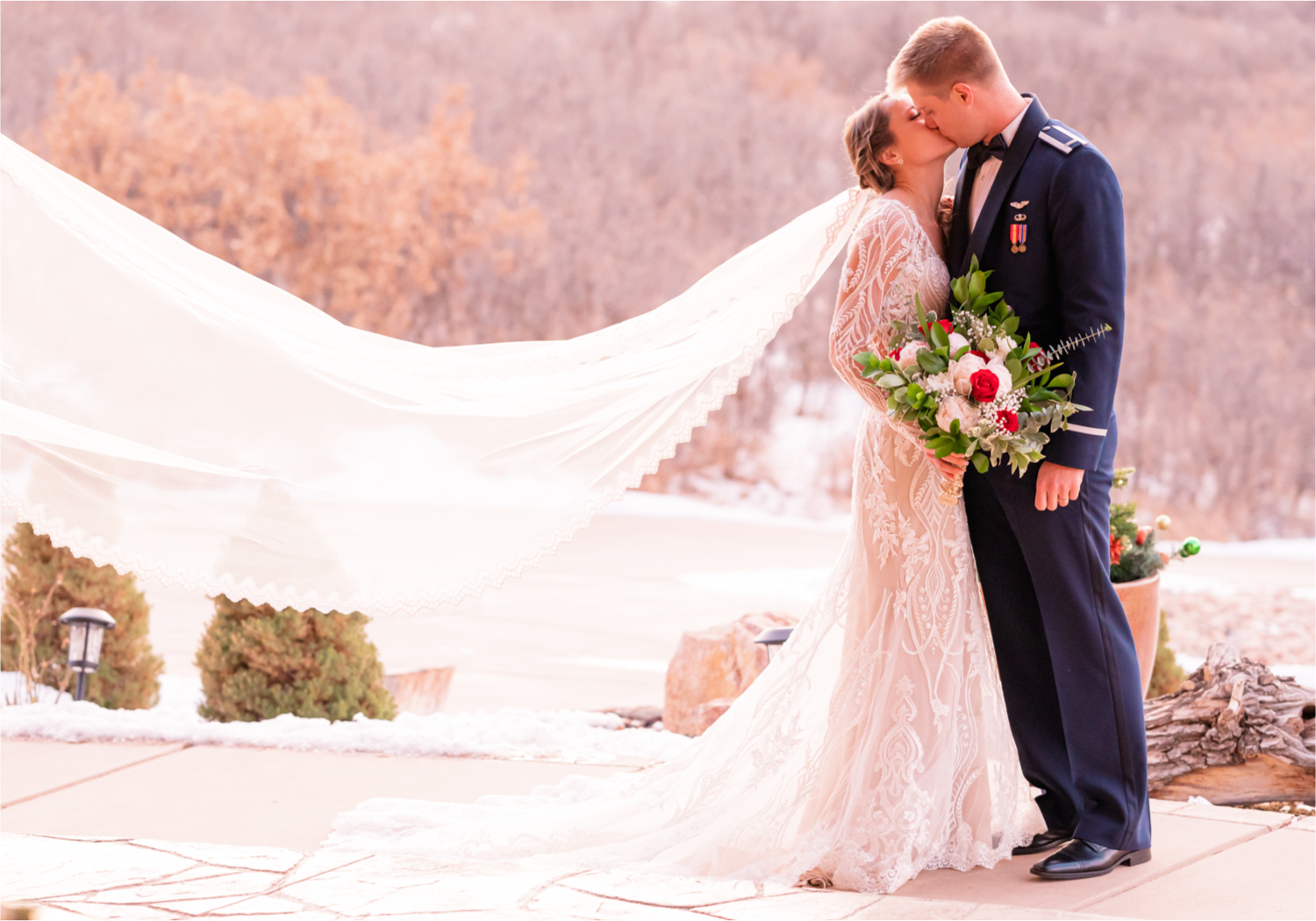 Winter Wonderland Wedding in Colorado Springs | Britni Girard Photography Colorado Wedding Photography and Film Team | Snow covered mountains and Christmas just a few days away | Annika + John's Nostalgic Winter Wedding | Bride's Dress iDream Bridal Essence of Australia | Air Force Academy | Sunset just married photos with veil flying