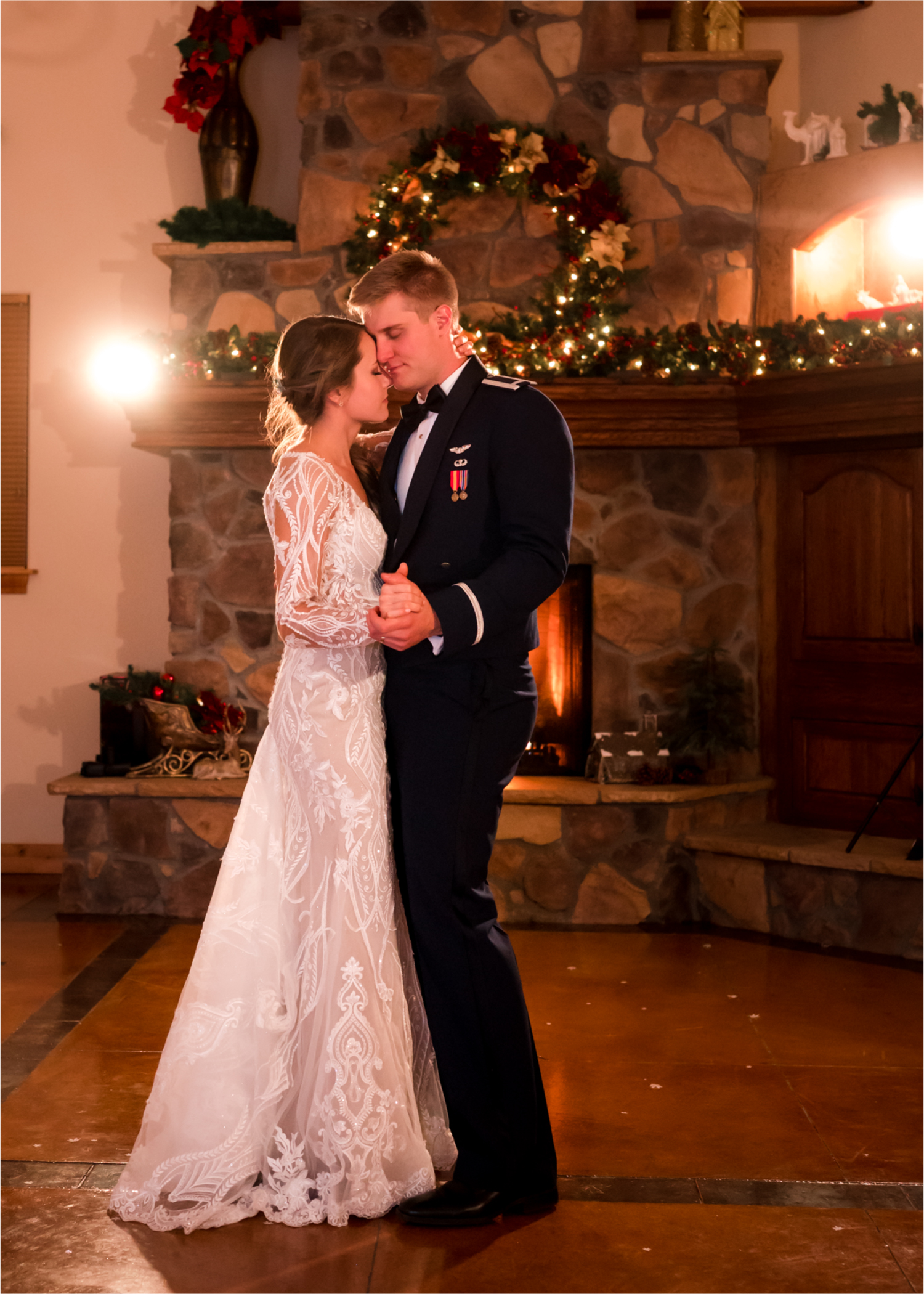 Winter Wonderland Wedding in Colorado Springs | Britni Girard Photography Colorado Wedding Photography and Film Team | Snow covered mountains and Christmas just a few days away | Annika + John's Nostalgic Winter Wedding | Bride's Dress iDream Bridal Essence of Australia | Air Force Academy | Rustic Winter Reception Bride and Groom Last Dance by Fireplace