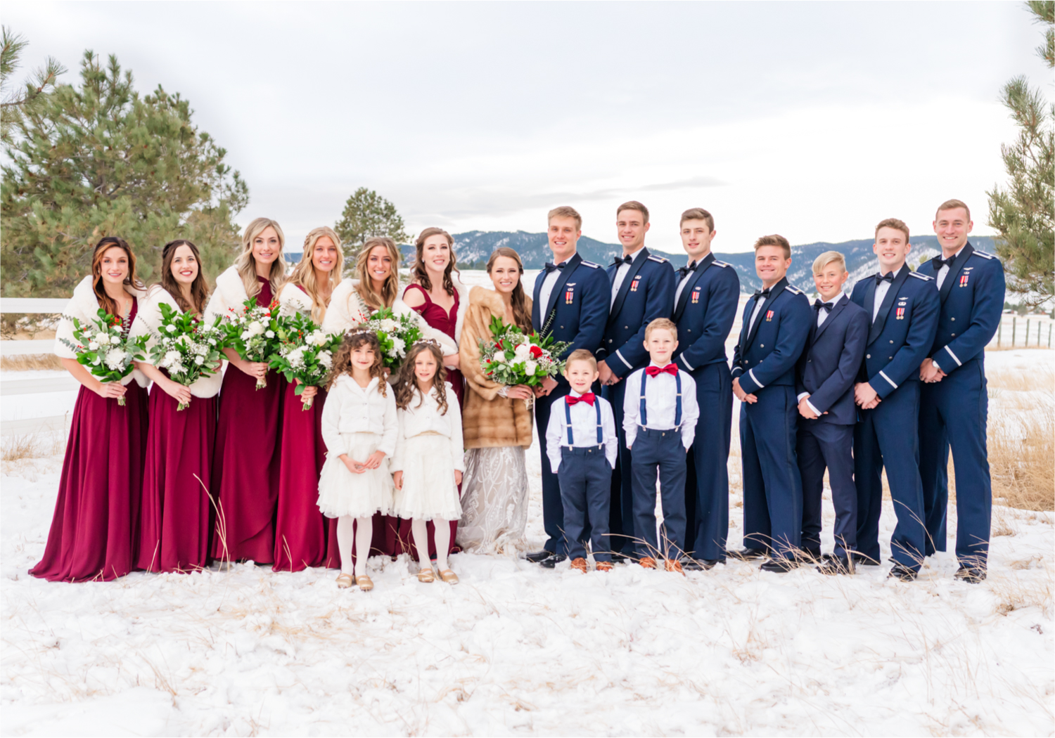 Winter Wonderland Wedding in Colorado Springs | Britni Girard Photography Colorado Wedding Photography and Film Team | Snow covered mountains and Christmas just a few days away | Annika + John's Nostalgic Winter Wedding | Bride's Dress iDream Bridal Essence of Australia | Air Force Academy | Snowy Wedding Party Portraits with Fur minks for bridesmaids in Azazie dresses