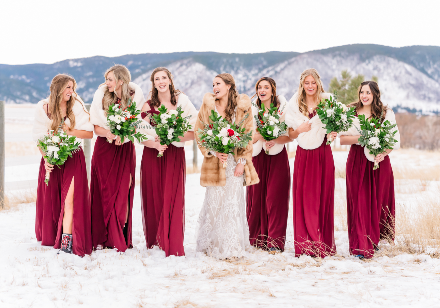 Winter Wonderland Wedding in Colorado Springs | Britni Girard Photography Colorado Wedding Photography and Film Team | Snow covered mountains and Christmas just a few days away | Annika + John's Nostalgic Winter Wedding | Bride's Dress iDream Bridal Essence of Australia | Air Force Academy | Snowy Wedding Party Portraits with Fur minks for bridesmaids in burgundy Azazie dresses