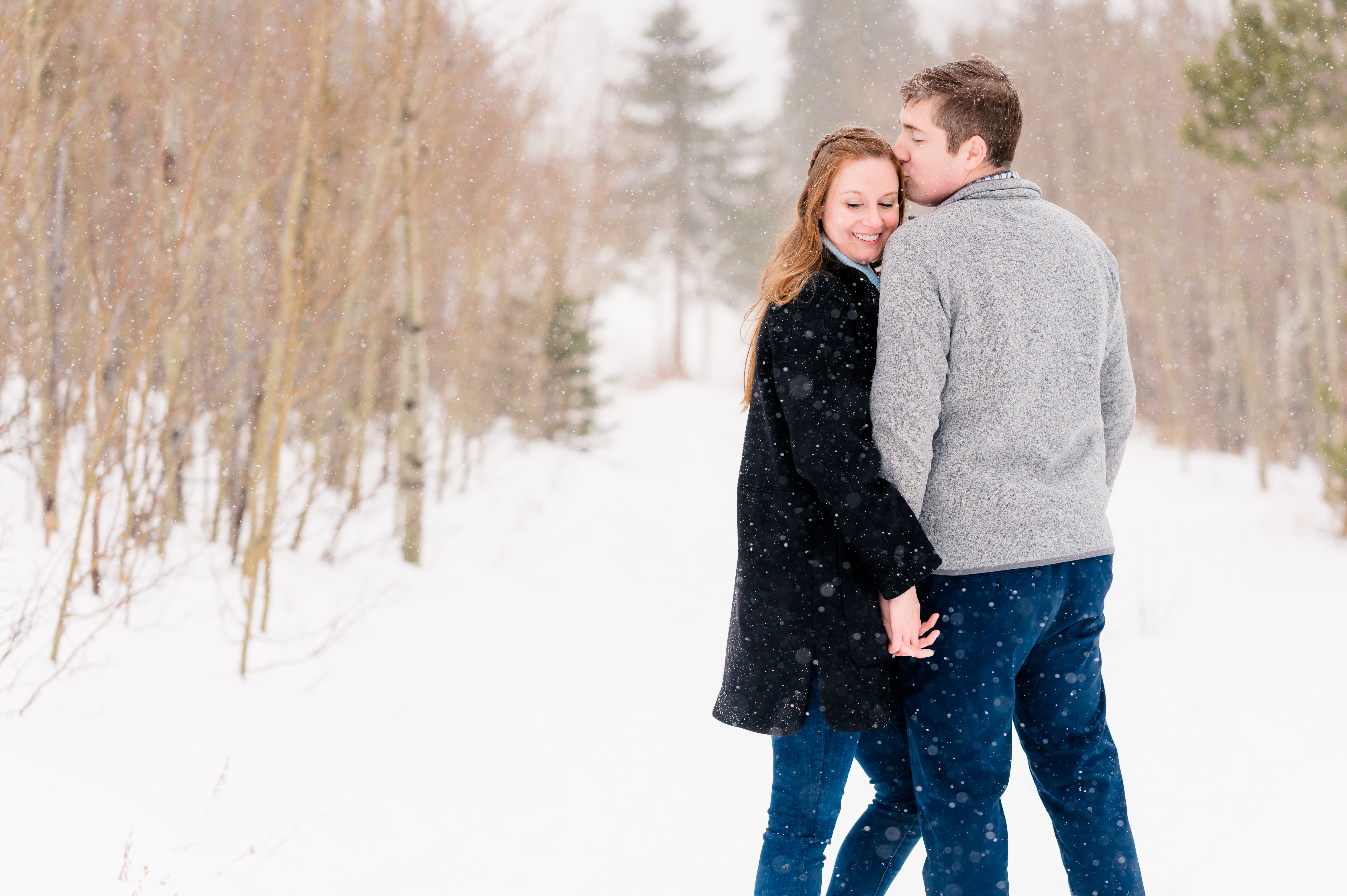 Snowy Lily Lake Engagement | Estes Park Colorado | Britni Girard Photography and Film | Winter Engagement in Rocky Mountain National Park | Walking in Aspen trees