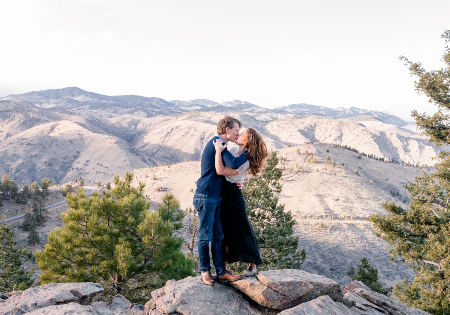 Winter Engagement on Lookout Mountain in Golden Colorado | Britni Girard Photography | Destination Photo and Video Team | Epic views of Golden, dreamy sunsets, dancing and snuggles.  A sweet couple shares time of prayer together during their romantic engagement session.