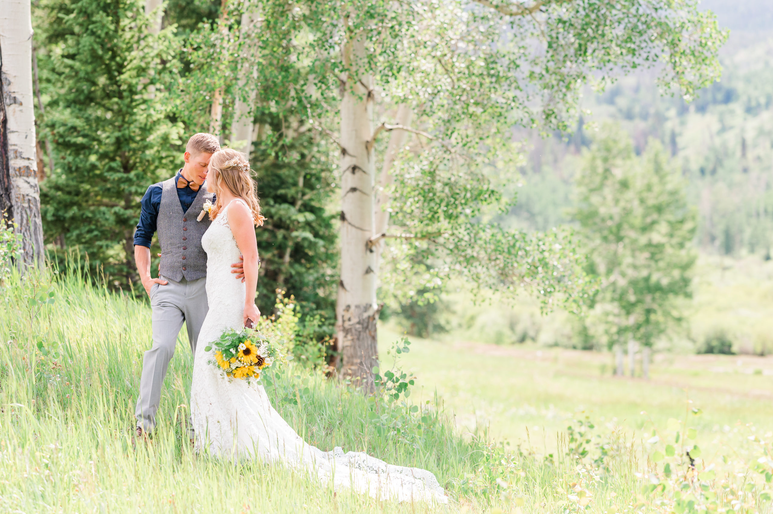 Rustic Summer Wedding in Granby | Britni Girard Photography | Colorado Destination Wedding Photo and Video Team | Surrounded by beautiful Mountain views on a private estate | Dress - The from The Alter Bridal in Lakewood | Florals by The Holly Berry | Hair and Makeup by Callie Graham | Bridesmaid Dresses from Azazie