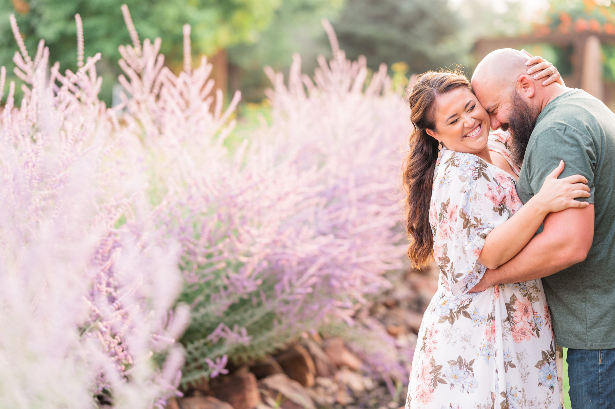 Sunset Engagement at The Hillside Vineyard in Fort Collins | Britni Girard Photography | Destination Colorado Wedding Photographer and Videographer | Strolling along a mountain Stream in flowy white floral dress