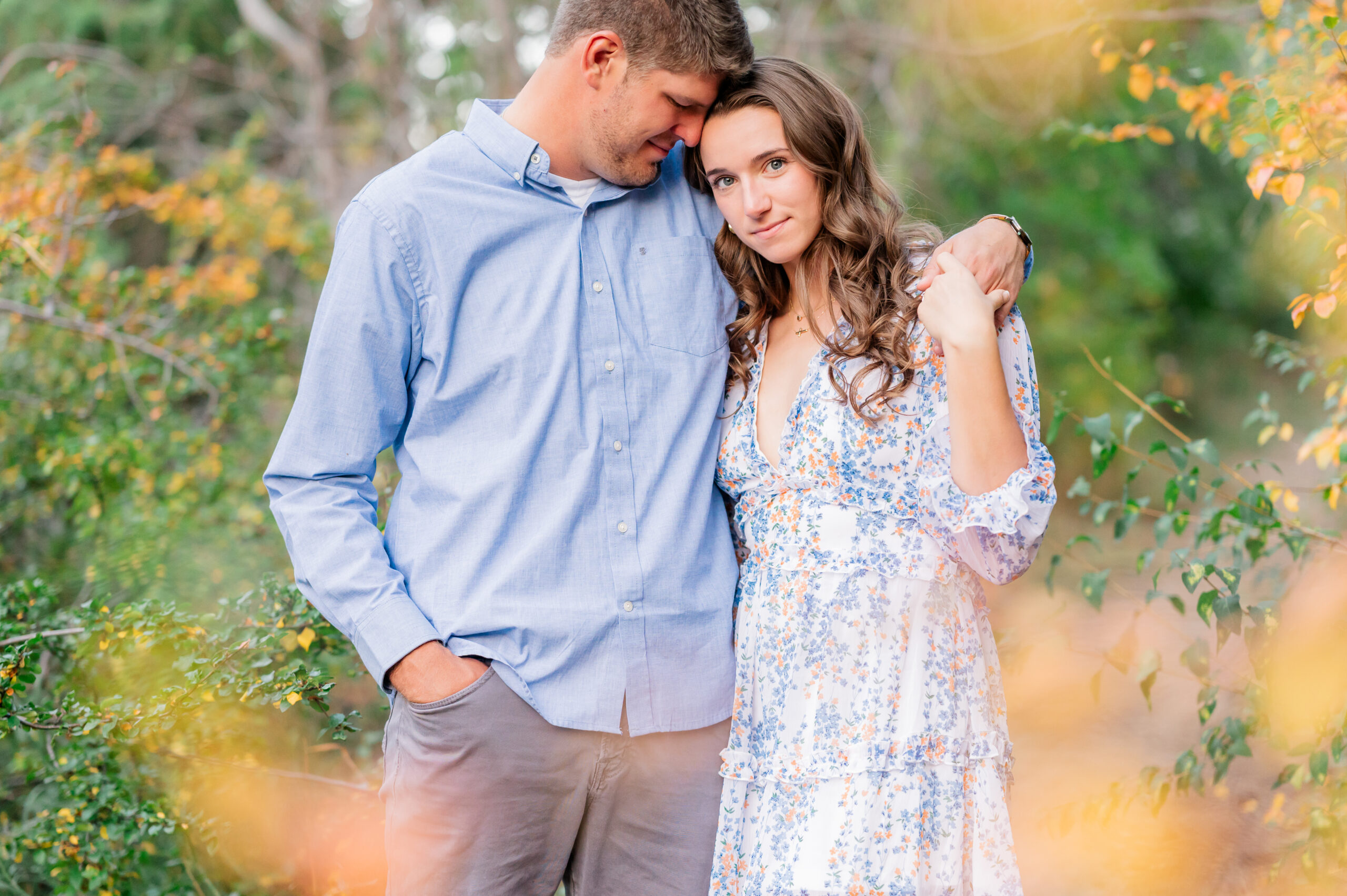 Megan and Jake's love story, marked by serendipitous meetings, a surprise engagement under fireworks, and cherished moments like strolling through the Rocky Mountains, culminates in their wedding at The Barn at Raccoon Creek. - Britni Girard Photography